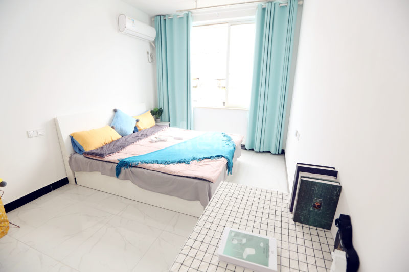 壹家公寓新惠名苑店7330171卧室图2